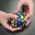 Hands holding a Dodecahedron Rubik's Cube, a challenging puzzle with 12 sides