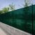 Green shade net installed on fence for privacy