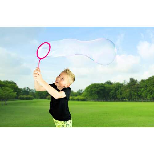 Child blowing giant bubble with FruBlu hoop bubble blower
