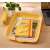 Leitz COSY yellow A4 document tray on a desk with office supplies