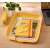Leitz COSY yellow A4 document tray on a desk with office supplies