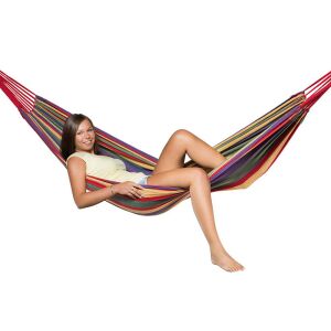 Woman relaxing in a striped hammock - Hammock