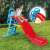 Red and blue plastic slide for kids, with ladder and handrails, water fun