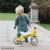 Toddler with Diditrike Giraffe balance bike outdoors