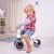 Child riding Diditrike Zebra balance bike indoors