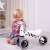 Child riding a Didi trike Zebra push trike for toddlers, no pedals, white and black zebra design