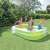 Intex Family Pool, 262 x 175 x 56 cm, inflatable pool for family fun, green color, people enjoying the pool