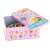 Pink tin box with 24 animal puzzles for kids, open to show the puzzles inside