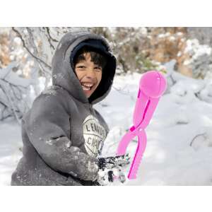 Child using Ikonka Snowball Maker, pink plastic snow ball tool - Outdoor Toy