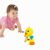 Toddler reaching for Hola Toys Dancing Duck - Interactive Toy for 18+ Months
