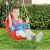 Child Enjoying Dolu Red Baby Swing Outdoors