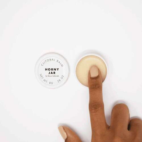 Horny Jar Clitoral Balm by Bloom Intimate, 8g, a small white jar with a finger applying the balm