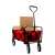 Piros összecsukható kerti kocsi fekete fém váz és kerekek, tele kartondobozokkal