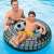Intex Monster Truck inflatable swim ring, black and grey, 45 inches, in use