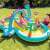 Family enjoying the Intex Dinosaur Inflatable Play Center on a sunny day