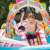 Child sliding down the Intex Candy Zone inflatable pool slide