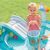 Child with bucket near Intex Alligator Inflatable Pool