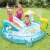 Intex inflatable pool with slide, alligator sprinkler, and umbrella - three people playing
