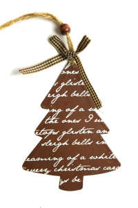 Brown metal Christmas tree ornament with white lettering, hanging from a twine string with a brown and white checkered bow - Christmas tree ornament