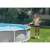 Woman using INTEX pool cleaning net to clean her pool