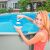 Intex floating chemical dispenser in use, adding chlorine tablet to pool