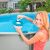 Intex floating chemical dispenser in use, adding chlorine tablet to pool