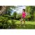 Woman using Riwall PRO RALT 2320 cordless grass trimmer in garden