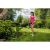 Woman using Riwall PRO RALT 2320 cordless grass trimmer in garden