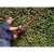 Einhell GE-EH 7067 electric hedge trimmer, man using the hedge trimmer