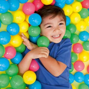 Child playing in a ball pit with Bestway 6.5cm colorful plastic balls - Bestway