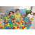 Child playing in a ball pit with Bestway 6.5cm colorful plastic balls