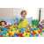 Child playing in a ball pit with Bestway 6.5cm colorful plastic balls