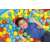 Child playing in a ball pit with Bestway 6.5cm colorful plastic balls