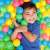 Child playing in a ball pit with Bestway 6.5cm colorful plastic balls