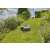 Gardena SILENO life 1000 robotic lawnmower mowing grass on a slope in a garden