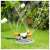 Bradas White Line WL-Z16 3-arm rotating sprinkler in use, watering a garden