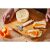 Fiskars Functional Form soft cheese slicer in use