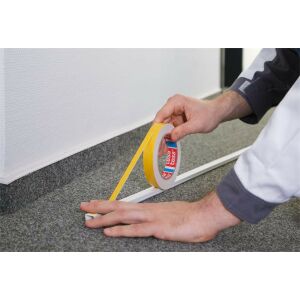 Applying TESA Powerbond Slim Mounting Tape to cable channel, double sided adhesive tape - Office accessory