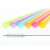 Close up of 5 colorful reusable plastic drinking straws and a cleaning brush