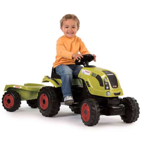 Gyermek egy zöld Smoby Claas Arion 400 Farmer XL pedálos traktoron ül, pótkocsival - Járgány