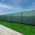Springos green shade net installed on a fence for privacy
