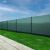 Springos green privacy screen installed on a chain link fence