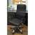 Black mesh office chair with adjustable height and tilt function, Malatec Prémium, in a home office setting