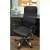 Black mesh office chair with adjustable height and tilt function, Malatec Prémium, in a home office setting