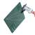 Green self-healing cutting mat, A5 size, with grid lines and angle guides, being measured with a caliper
