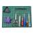 Green self-healing cutting mat, A5 size, with grid lines and angle guides, shown with various craft tools