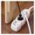 Emos 3-socket extension cord, 2 meters long, white, in use