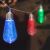 Colorful LED string lights with reindeer and snowflake design, bulb shape