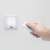 Hand holding remote control for LED wall lamp