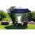 Funfit premium tilting garden parasol with steel frame and crank, 3.5m, dark blue, in a garden setting with furniture